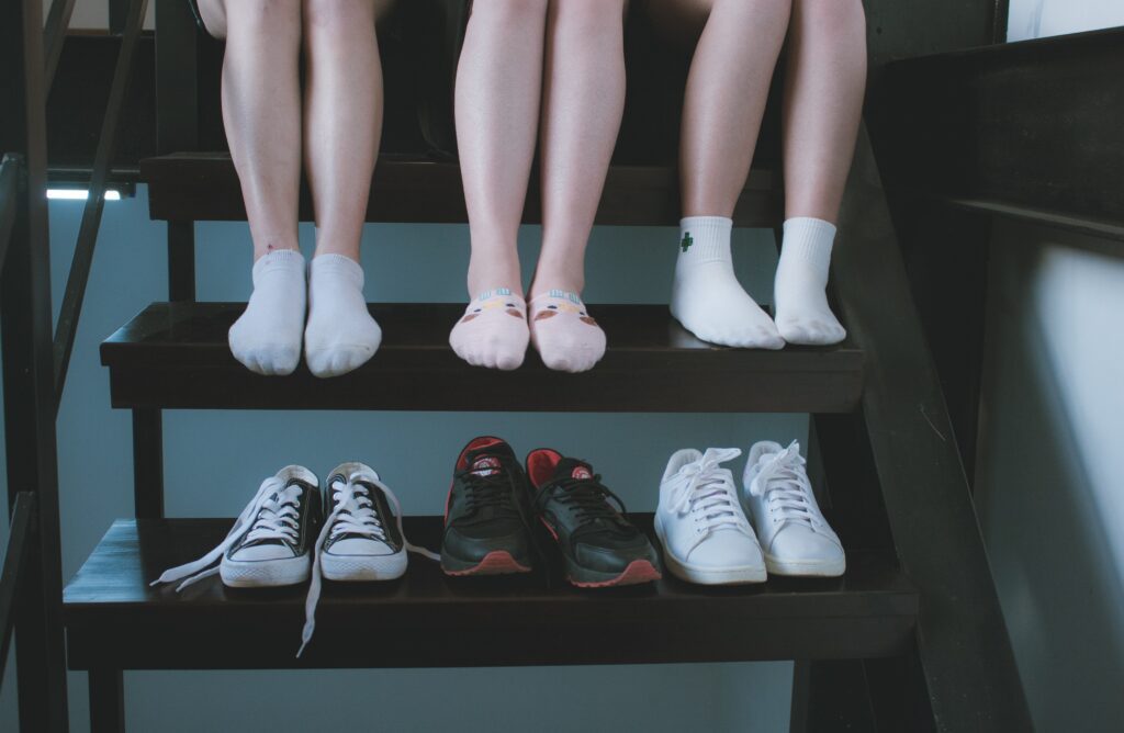 Different feet with different types of shoes
