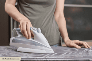 a wardrobe dayworker ironing a shirt
