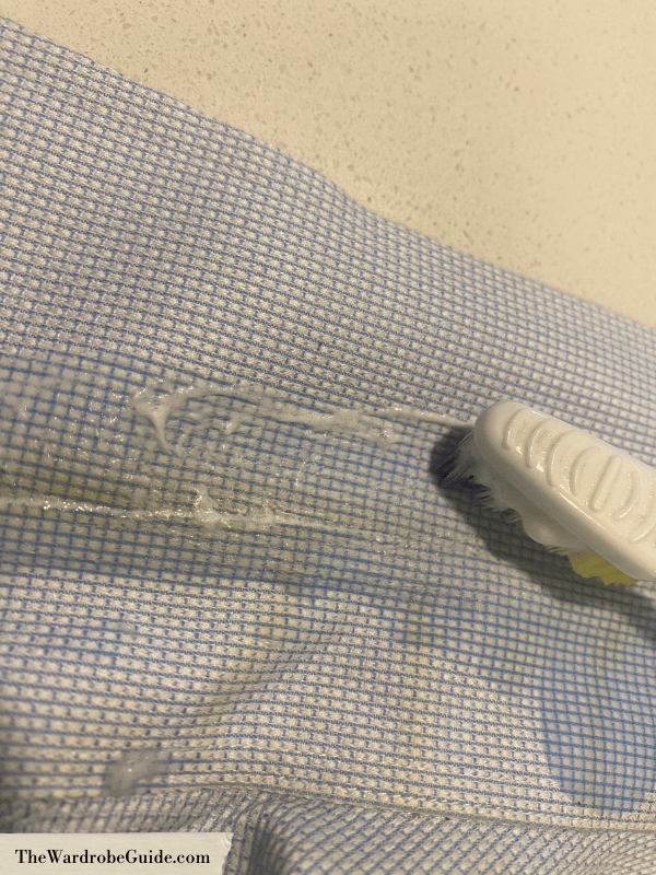 Scrub the collar with a toothbrush to remove collar stains