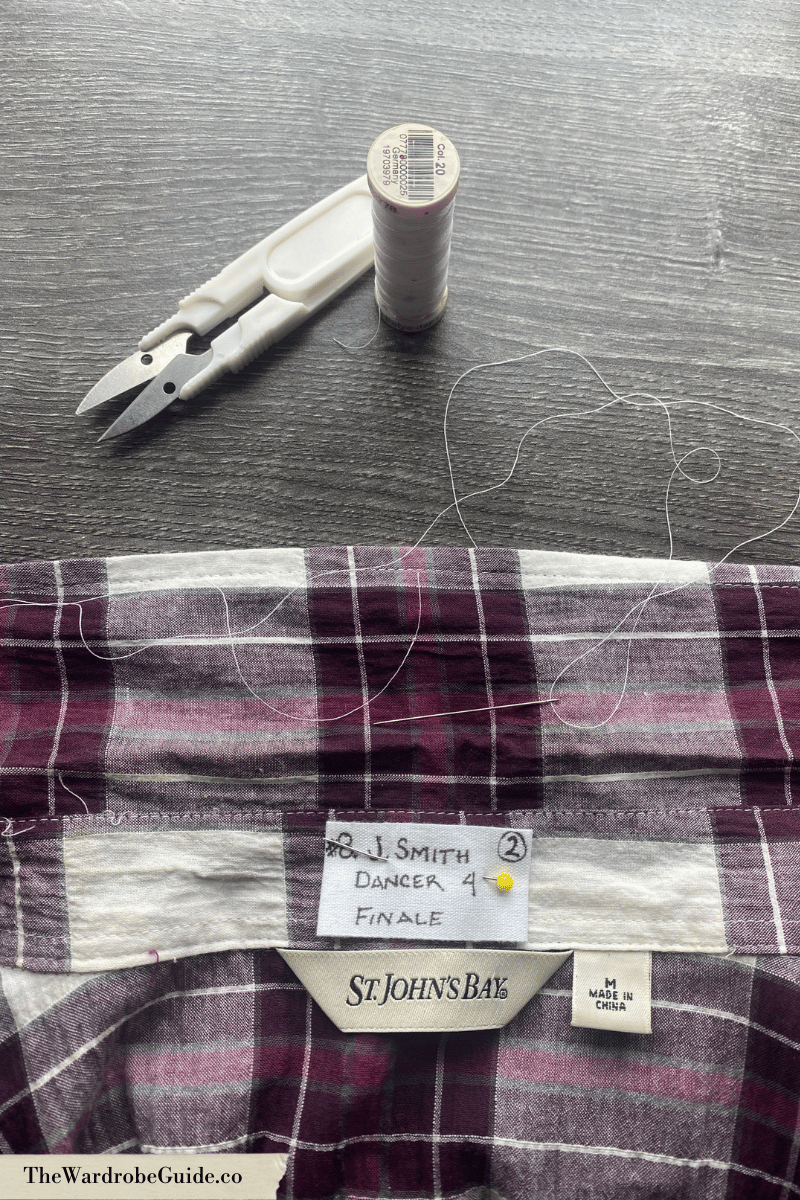 prepping a label be be sewn on a theatre costume